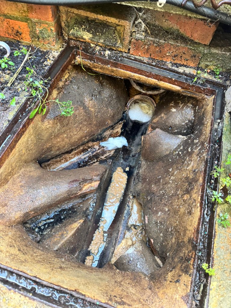 blocked drain with sludge